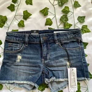 Girls denim shorts with two rips on the front.